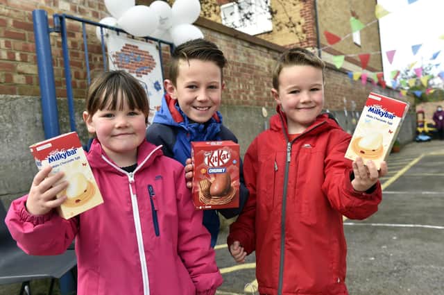 From left, Carmen Taylor, four, Lincoln Taylor, 10, and Ellis Taylor, six with their Easter eggs.
Picture: Allan Hutchings (030421-3022)