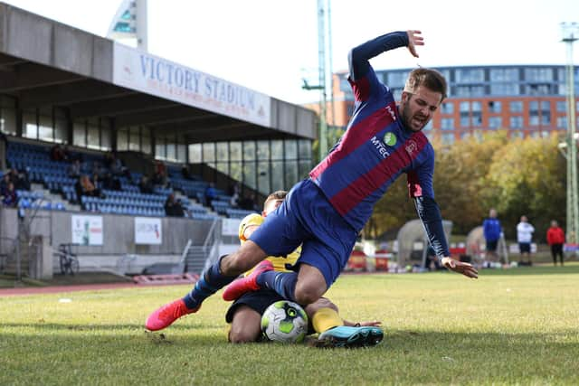 Dec Seiden is tackled in the Downton penalty box during US Portsmouth's 5-1 Wessex League win. Picture: Chris Moorhouse