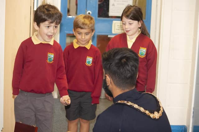 Purbrook Infant School had their parent-funded library opened by Havant mayor Prad Bains. Pictured: Cllr Bains meeting some of the children who will use the library