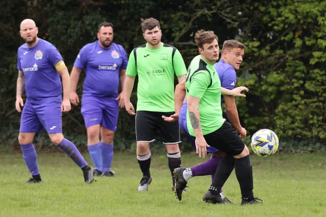 Action from the City of Portsmouth Sunday League Division Four match between AFC Bedhampton Village reserves (green and black kit) and Friends Fighting Cancer. Picture: Kevin Shipp