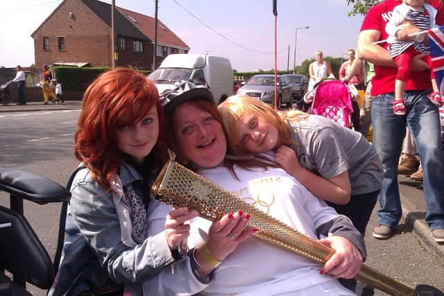 Torch bearer Caroline Waugh was the first torch bearer in Doncaster. She is pictured with her children Daisy and Finn.
