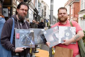 Simon Herne and Bradley Sunderland with their purchases from Pie and Vinyl. Picture: Keith Woodland (230421-8)