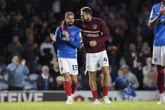 Kieron Freeman, left, with Pompey skipper Clark Robertson