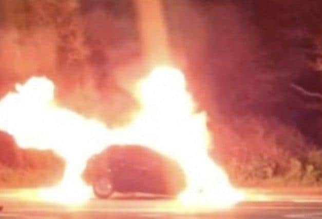 A man and dog escaped a car fire on the Eastern Road