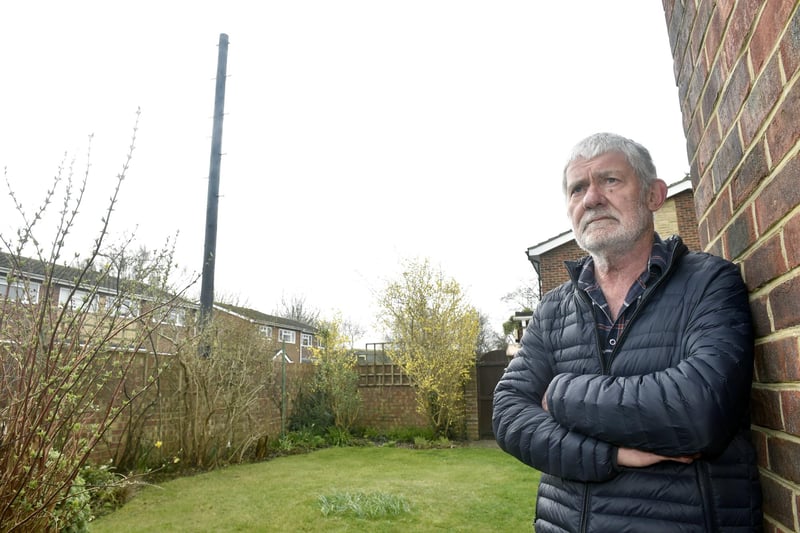 John Rowlands from Woodside, Gosport, is angry that Toob has installed an "eyesore" telegraph pole meters from his garden without prior consultation. Picture: Sarah Standing