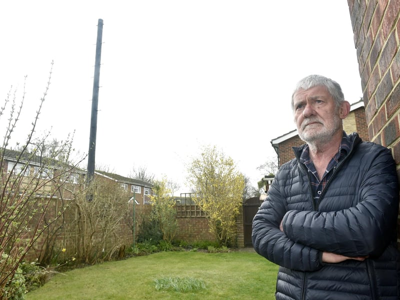 John Rowlands from Woodside, Gosport, is angry that Toob has installed an "eyesore" telegraph pole meters from his garden without prior consultation. Picture: Sarah Standing
