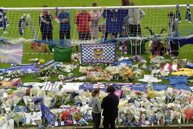 Fans pay homage to Aaron Flahavan in the goalmouth underneath the Fratton End, with a Southampton shirt touchingly also present. Picture: Malcolm Wells