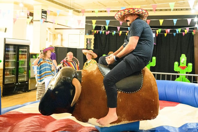 Pictured is: Riding the mechanical bull.

Picture: Keith Woodland