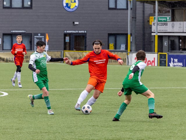 Action from the Under-13 Truman Challenge Cup final between Denmead Youth Lions (orange shirts) and Moneyfields Youth Yellow. Picture: Mike Cooter