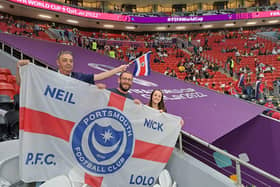 The unique Pompey FC flag bears the Portchester family members' names as they enjoy the trip of a lifetime - with high praises for host nation Qatar.