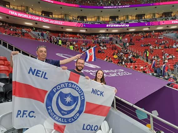 The unique Pompey FC flag bears the Portchester family members' names as they enjoy the trip of a lifetime - with high praises for host nation Qatar.