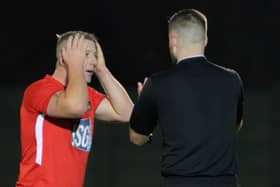 A Fareham player reacts after referee Lewis White fails to send off Brockenhurst keeper James Mayo. Picture: Martyn White.