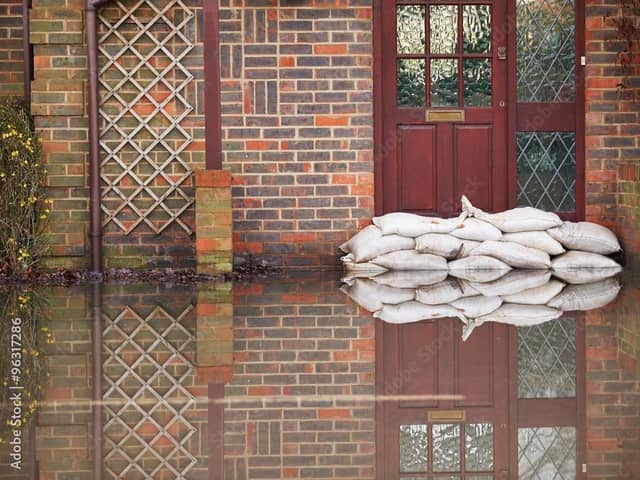 Trying to keep out flood water. Photo: Adobe