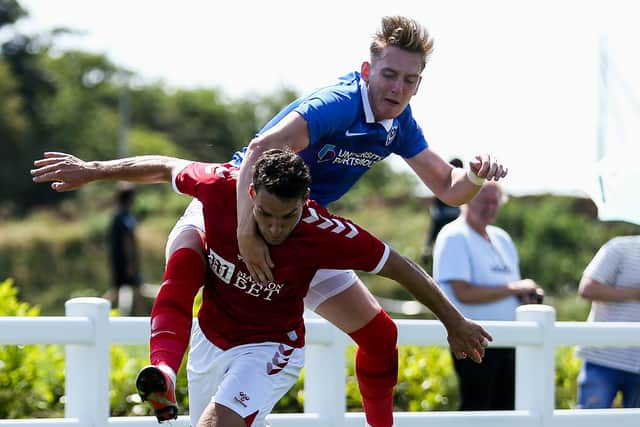 Ronan Curtis tussles with Matty James during Pompey's friendly with Bristol City. Picture: Rogan Thomson/ JMP Sport