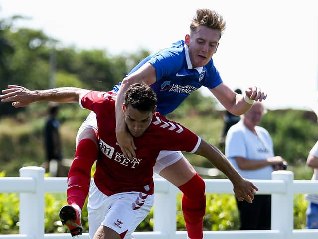 Ronan Curtis tussles with Matty James during Pompey's friendly with Bristol City. Picture: Rogan Thomson/ JMP Sport
