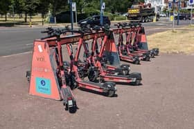Voi e-scooters at a parking station in Southsea
