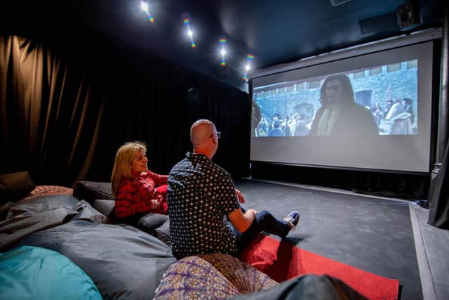 Southsea Community Cinema is turning one next week.
Pictured: Aysegul Epengin with a guest watching a film at the community cinema, Southsea.
Picture: Habibur Rahman