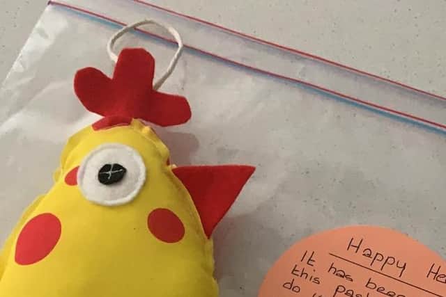 The Happy Hens are decorated with beads and ribbon