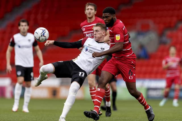 Ronan Curtis battles with Doncaster's Ro-Shaun Williams. Picture: Daniel Chesterton/phcimages.com