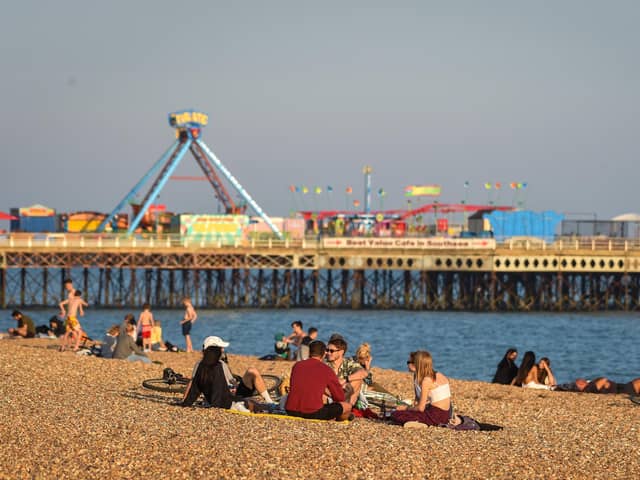 People enjoy the evening sunshine on Southsea beach.
(Photo by Finnbarr Webster/Getty Images)
