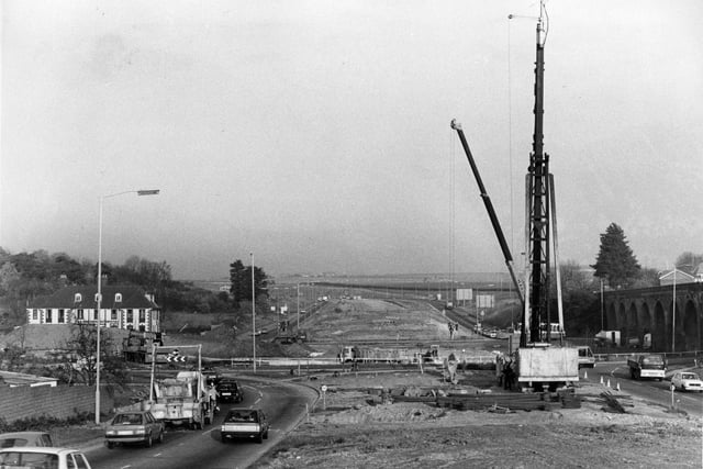 Fareham: Work in progress on the Delme Roundabout flyover with a giant pile-driver in position and the route the road would take. November 1983. Picture: The News PP987