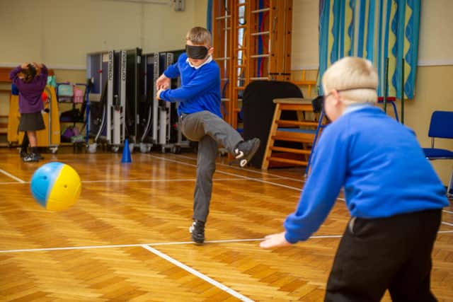 Sensory awareness day on 1st October 2021 at Kings academies Northern Parade school,  Portsmouth

Pictured: Jack 8 and Lloyd 8 playing football blindfolded

Picture: Habibur Rahman