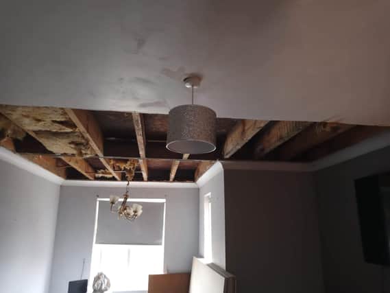 The ceiling has been stripped out but work cannot be done as water is still dripping through.