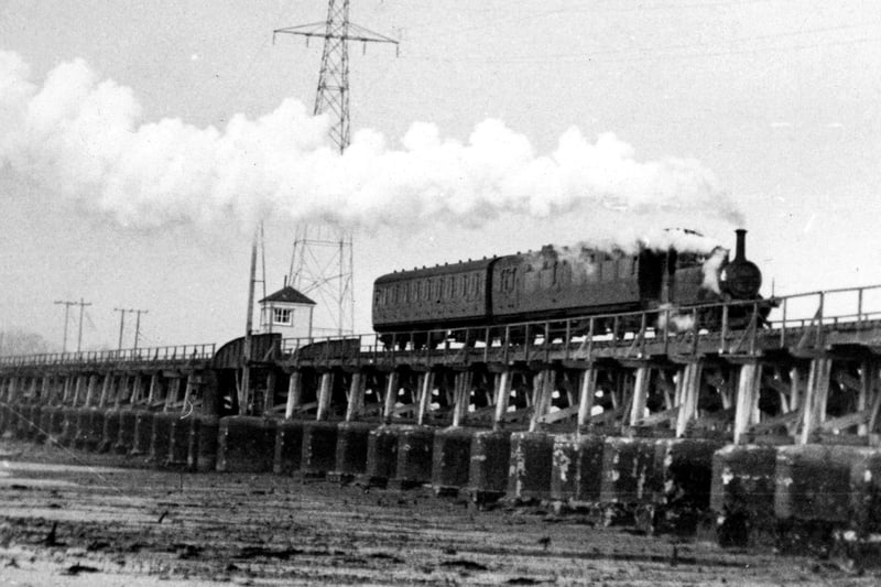 The Hayling Billy crosses Langstone Harbour at low tide. Picture: Paul Costen collection