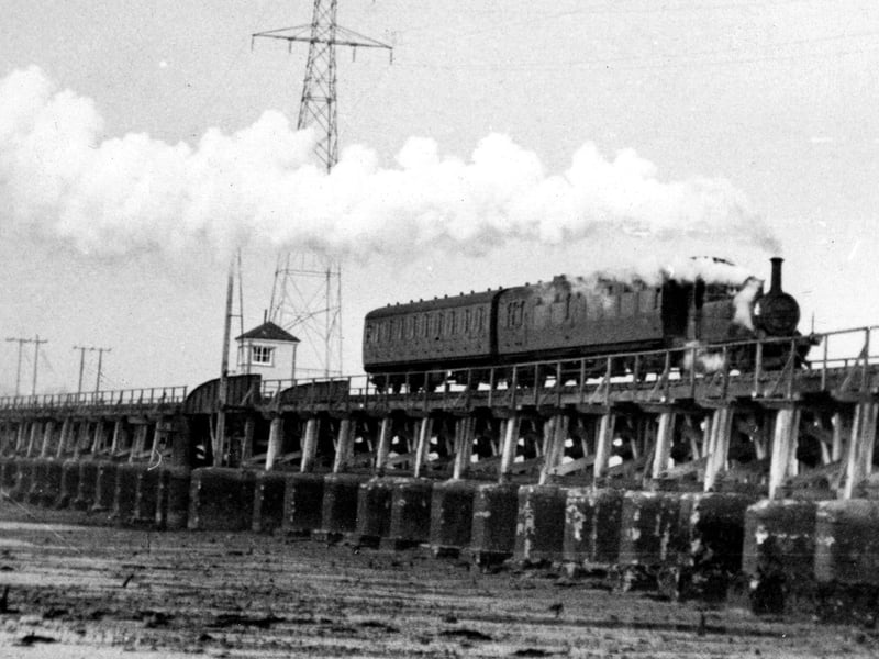 The Hayling Billy crosses Langstone Harbour at low tide. Picture: Paul Costen collection