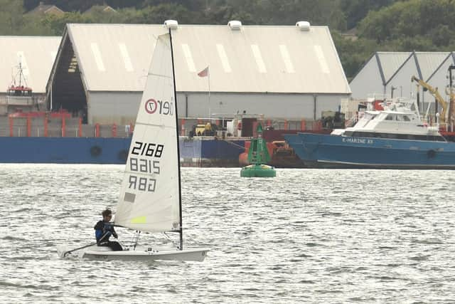 The rib struck this green buoy in Southampton water.  View across from Weston Shore to Hythe. Picture: Simon Czapp/Solent News & Photo Agency