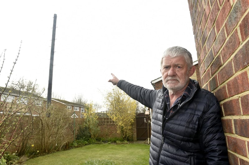 John Rowlands from Woodside, Gosport, is angry that Toob has installed an "eyesore" telegraph pole meters from his garden without prior consultation. Picture: Sarah Standing