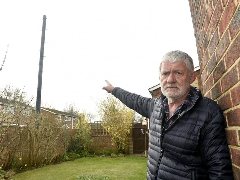 John Rowlands from Woodside, Gosport, is angry that Toob has installed an "eyesore" telegraph pole meters from his garden without prior consultation. Picture: Sarah Standing