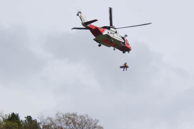 A Coastguard helicopter was used in the rescue effort. Picture: Peter Reed.