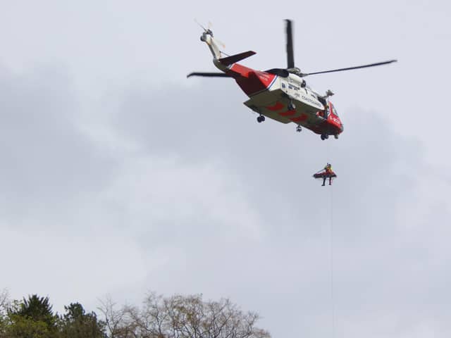 A Coastguard helicopter was used in the rescue effort. Picture: Peter Reed.