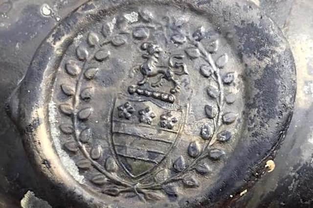 The crest of the Legge family who are ancestors of George Washington, the first US President, was found on a bottle with the wreck. Picture: Norfolk Historic Shipwrecks/PA Wire