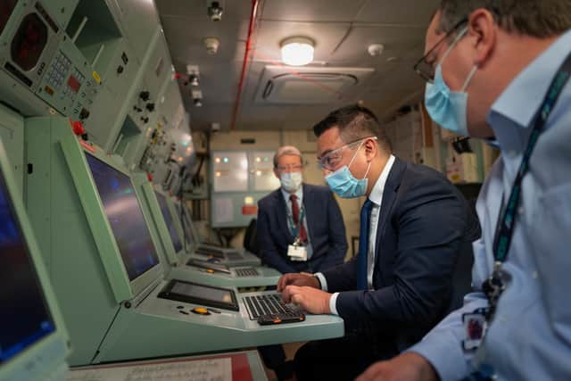 Alan Mak MP, centre, pictured during his tour of the National Maritime Systems Centre, on Portsdown Hill