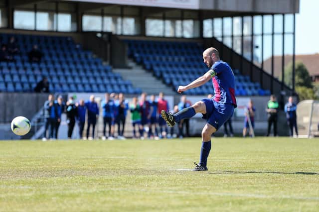 Newly-appointed player assistant manager Tom Jeffes scores the winning penalty for US Portsmouth in their FA Vase fourth round victory over Christchurch. Picture: Chris Moorhouse