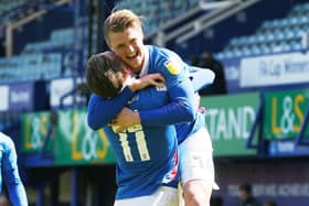 Ronan Curtis celebrates scoring his Pompey winner against Bristol Rovers with his goal's architect - George Byers. Picture: Joe Pepler