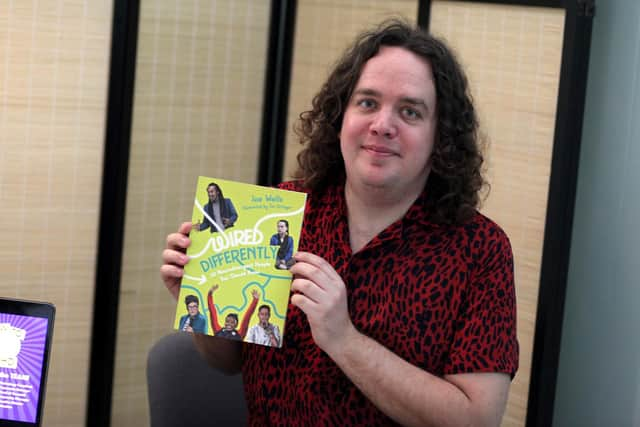 Portsmouth comic and author Joe Wells with a copy of his new book - Wired Differently, released May 2022. Picture by Ashleigh Spice