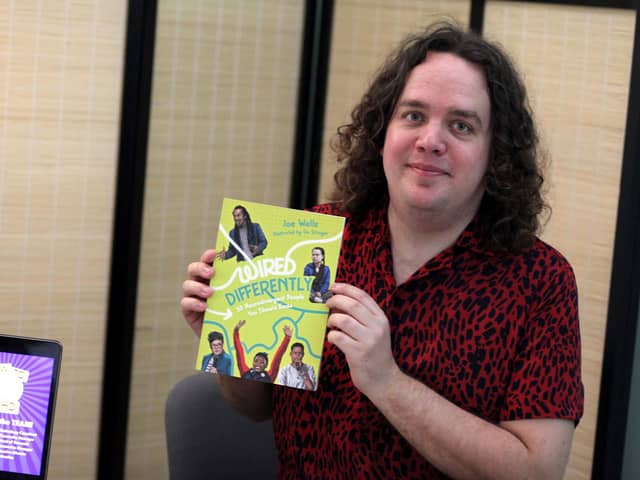 Portsmouth comic and author Joe Wells with a copy of his new book - Wired Differently, released May 2022. Picture by Ashleigh Spice