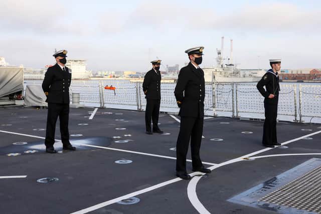 Pictured: Members of HMS Spey's ships company stand on the flight deck during ceremonial colours. Photo: Royal Navy