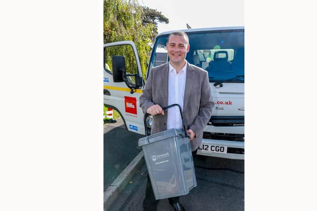 Cllr Dave Ashmore with one of the food waste caddies.