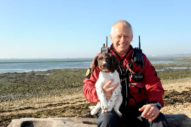 Bug Wrightson with his new Springer Spaniel puppy. Picture: Sarah Standing (061120-8030)