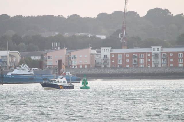 Southampton Harbour Master launch inspects a buoy off Hythe, Hampshire, after 12 people were taken to hospital when a rigid inflatable boat collided with a buoy on Saturday. A 15-year-old girl was pronounced dead in hospital. Picture: Harriet Line/PA Wire