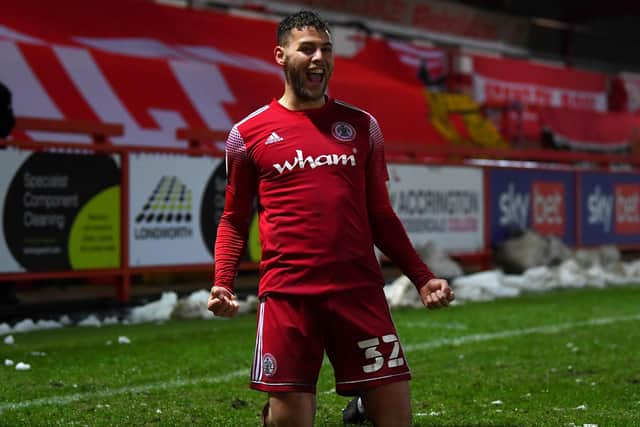 ACCRINGTON, ENGLAND - FEBRUARY 02: Dion Charles of Accrington celebrates scoring his 3rd goal during the Sky Bet League One match between Accrington Stanley and Bristol Rovers at The Crown Ground on February 02, 2021 in Accrington, England. Sporting stadiums around the UK remain under strict restrictions due to the Coronavirus Pandemic as Government social distancing laws prohibit fans inside venues resulting in games being played behind closed doors. (Photo by Gareth Copley/Getty Images)