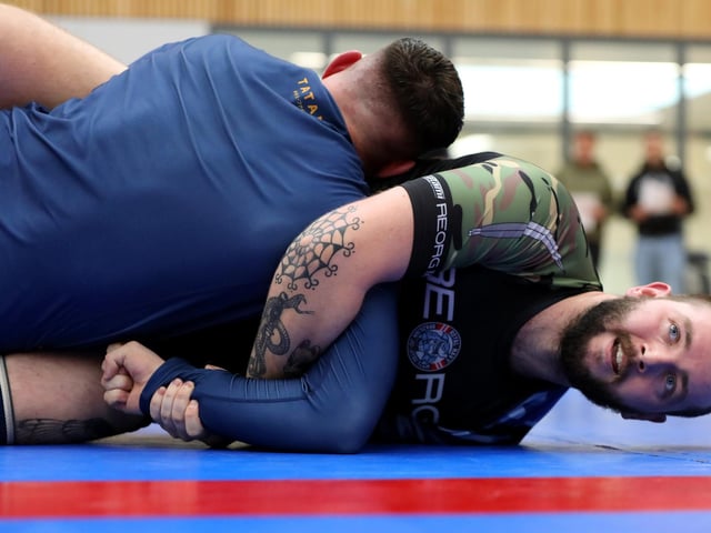 Matthew Forsyth, right, of the the Royal Navy team at HMS Sultan competing in a Brazilian Jiu Jitsu competition at the Ravelin Centre in Portsmouth. Picture: Chris Moorhouse (jpns 250223-01)