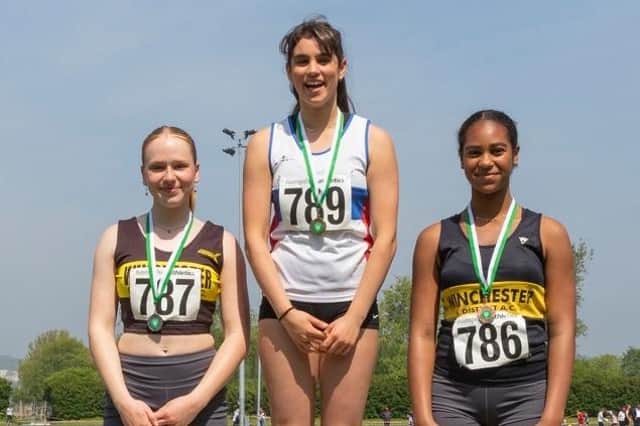 Charlotte Pabari on top of the podium after winning the under-15 girls javelin in record-breaking fashion. Picture by Paul Smith