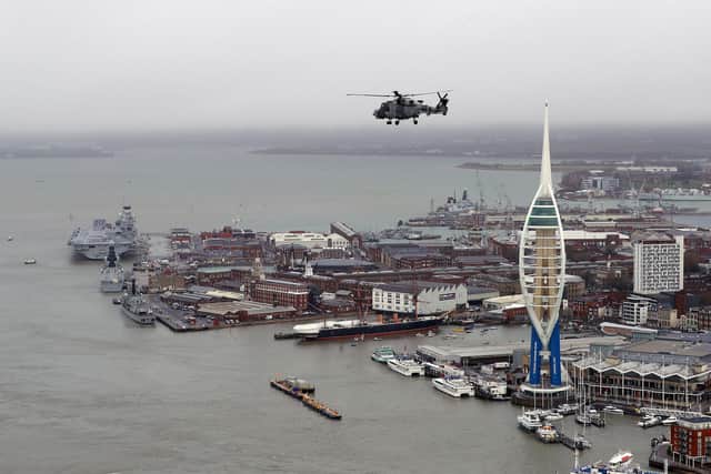 Pictured is the formation flypast for the commissioning of HMS Queen Elizabeth at HMNB Portsmouth. Her Majesty the Queen formally commissioned her namesake aircraft carrier, HMS Queen Elizabeth into the Royal Navy fleet, where a flypast consisting of two Wildcat HMA Mk2, Merlin Mk2, Sea King Mk7 and Merlin Mk3 flew overhead during the service