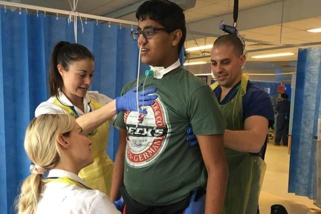 University of Portsmouth student Ben de Souza in Queen Alexandra Hospital after he fell ill with meningococcal septicaemia (MenB) which he mistook for a hangover