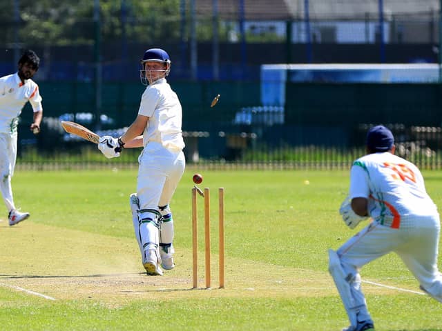 Fareham & Crofton 2nds' James Hawley is bowled by Kerala's Robish Hentry. 
Picture: Chris Moorhouse